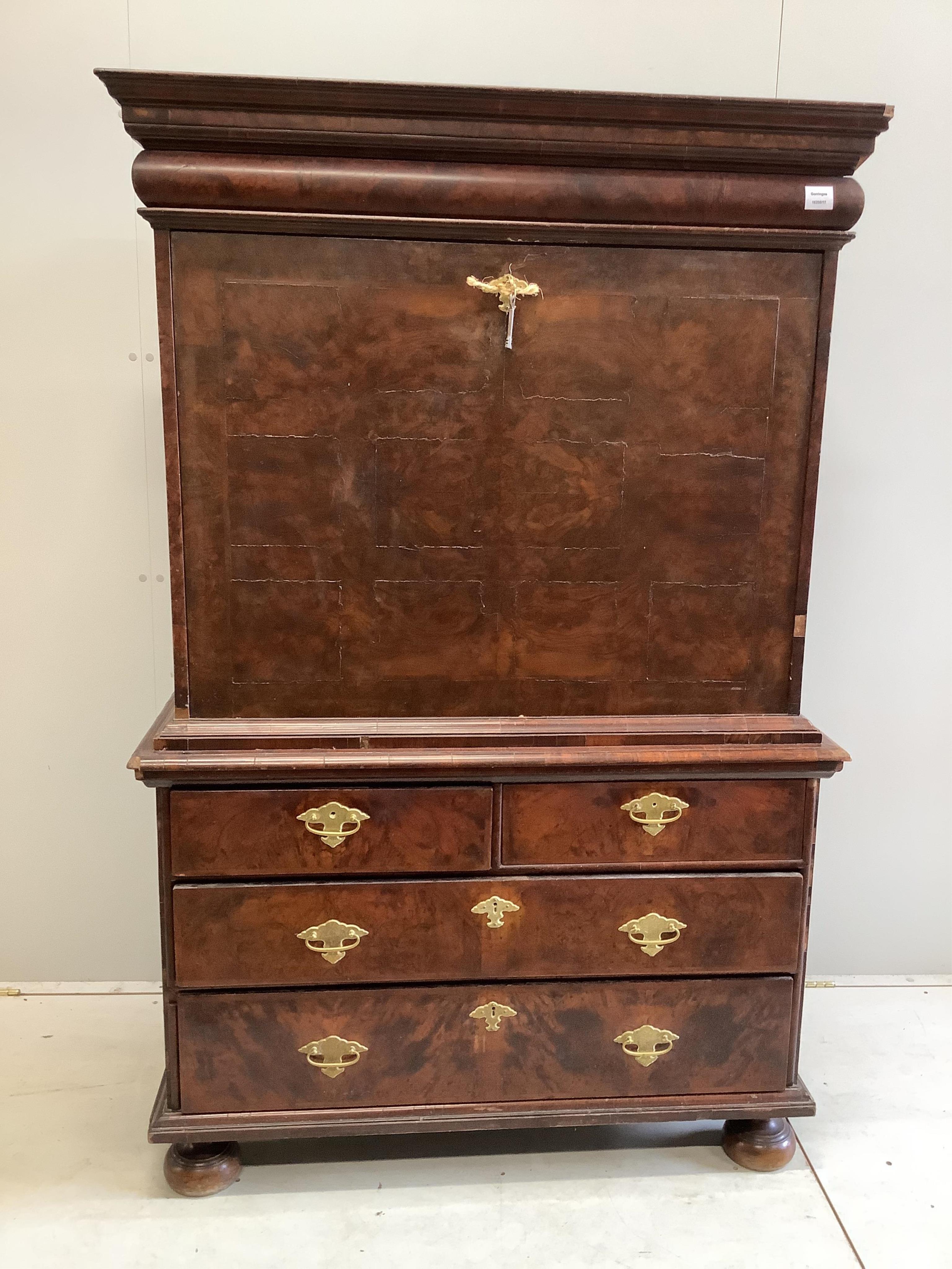 A Queen Anne escritoire, with three long graduated drawers, fall front opening to reveal drawers and pigeon holes, width 110cm, depth 52cm, height 168cm. Condition - fair